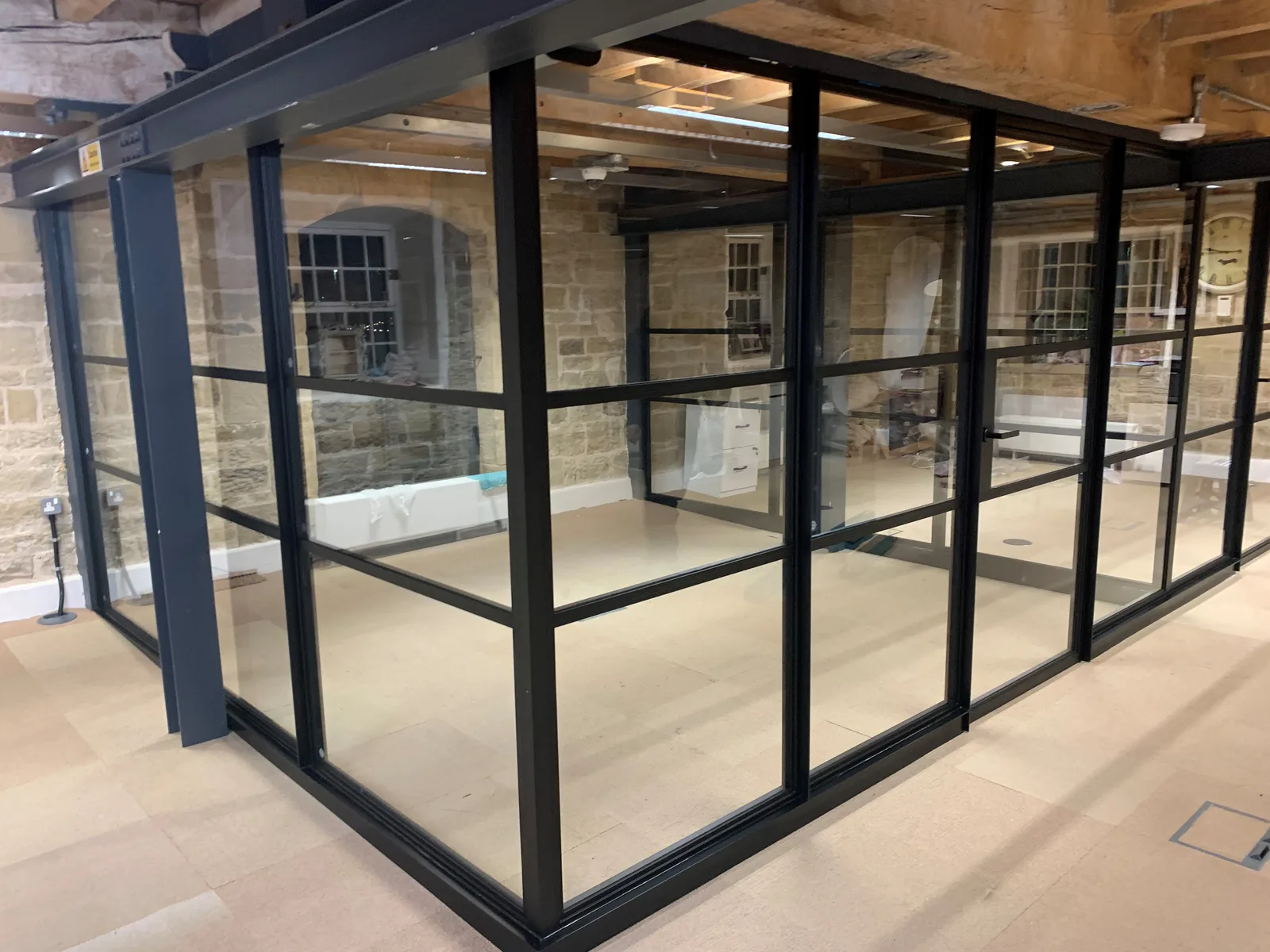 Heritage glass screen set within a grand stone interior
