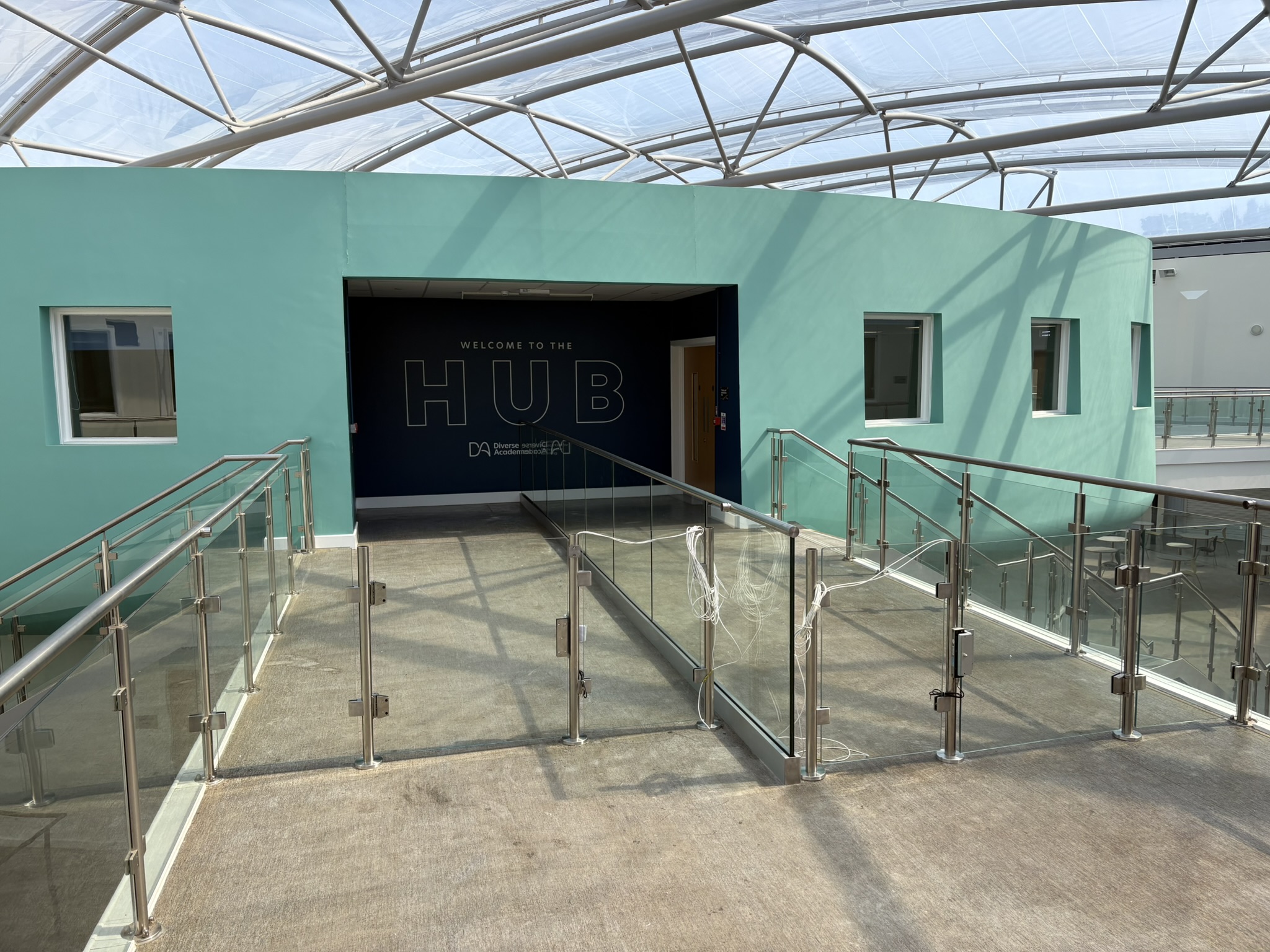 Glass balustrade and access control installation in the school atrium